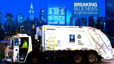 NYC sanitation trucks Light It Up Blue for World Autism Month