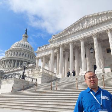 Vincent Feng standing in front of Capitol steps in DC