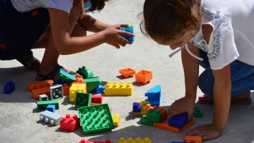 young girls playing with blocks during Floortime therapy