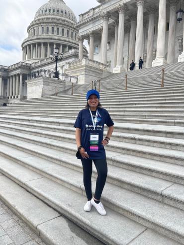 Saida M standing on Capitol steps at 2023 Advocacy Forum in DC