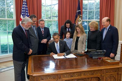 President Obama with Suzanne & Bob Wright and state representative signing the Autism CARES Act