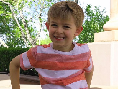 Jackie Bielinski's grandson Maxwell wearing an orange shirt