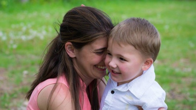 smiling mom and child, autism diagnosis