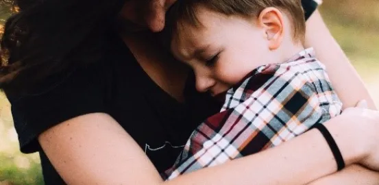 mother hugging child