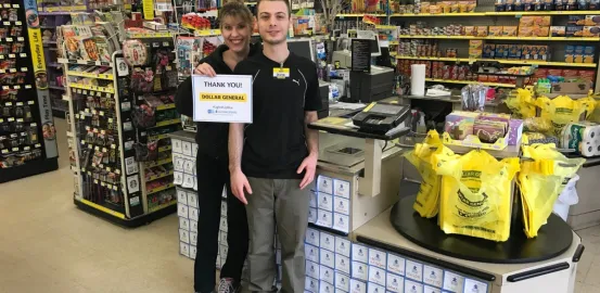 Dollar General employees holding up a thank you sign
