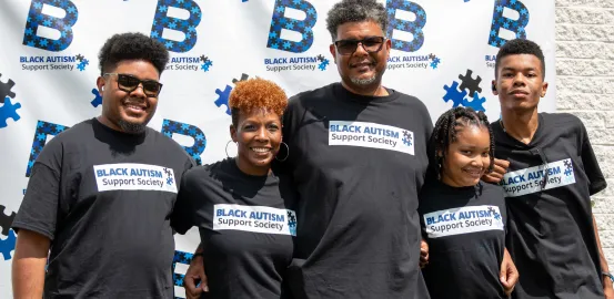 Kimacka and family at a Black Autism Support event