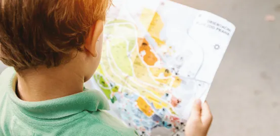 child looking at map