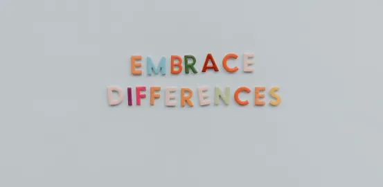 Letter magnets on a refrigerator that spell out Embrace Differences