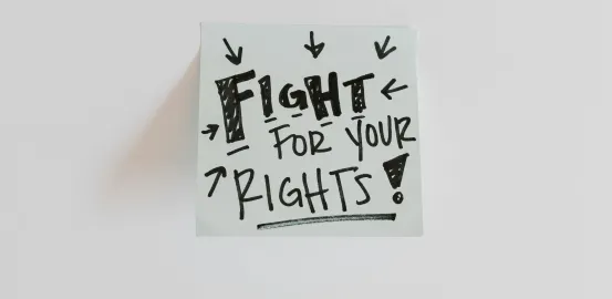 Post It note with a reminder to fight for your rights
