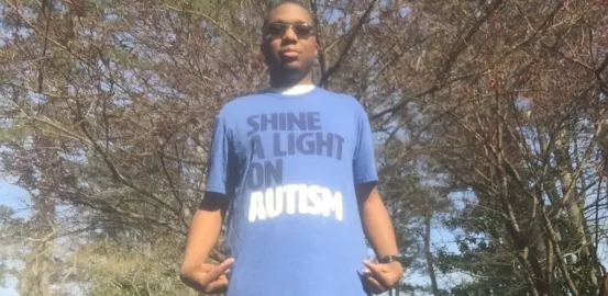 Ryan Lee wearing an Autism Speaks shirt