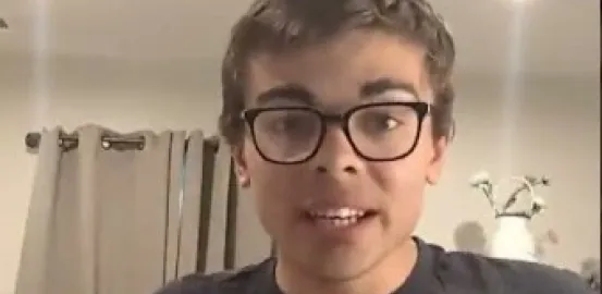 man in glasses wearing a shirt that says Be Kind to Everyone