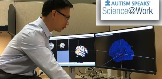 social neuroscientist Yung-Jui (Daniel) Yang looking at a computer
