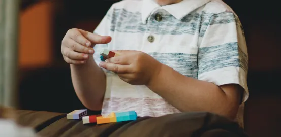 a child playing with blocks