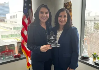 California Assemblymember Blanca Rubio receiving puzzle piece shaped Public Service Award