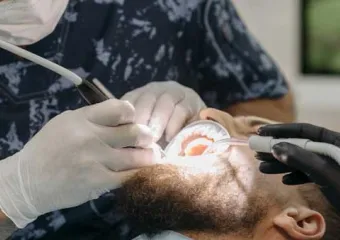 man with a beard getting dental work done