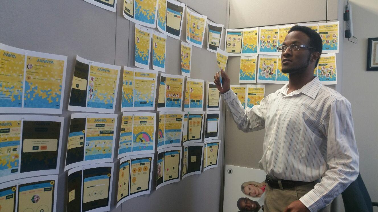 A young African American man organizes his thoughts using screenshots on a bulletin board.