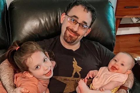 Andrew Komarow and his children