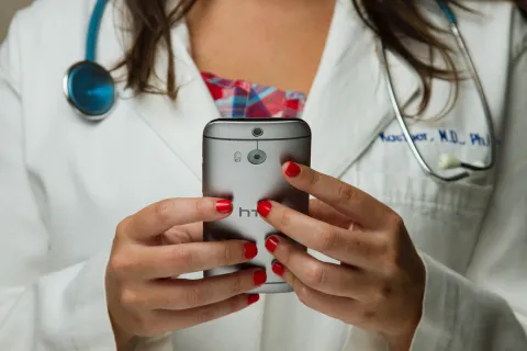 Doctor holding phone