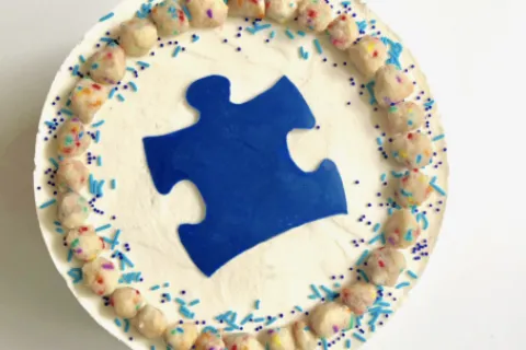 Cake with an autism symbol puzzle piece on it