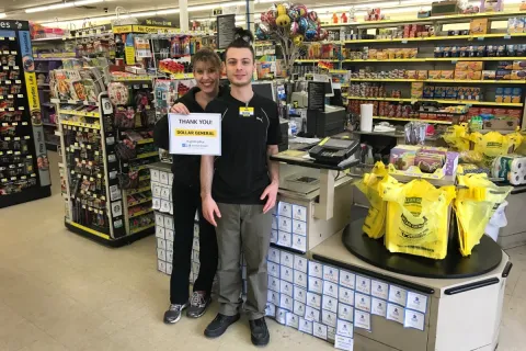 Dollar General employees holding up a thank you sign