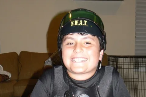 Ethan Hirschberg at age 11 wearing a SWAT team costume