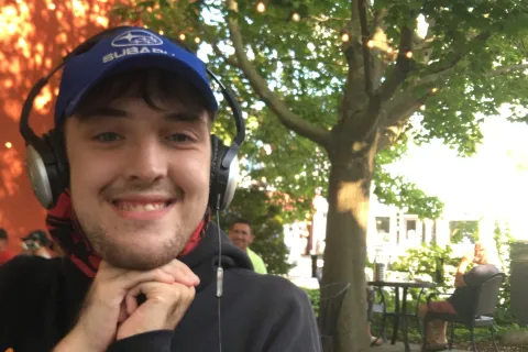 Jeff smiling at an outdoor cafe