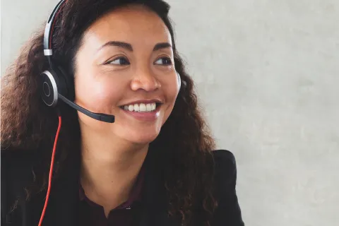 Woman wearing a headset on the phone