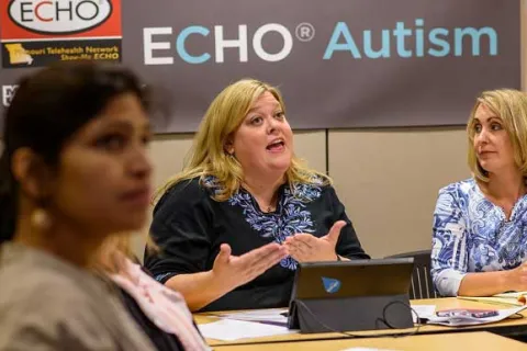 blonde woman speaking at an ECHO Autism conference