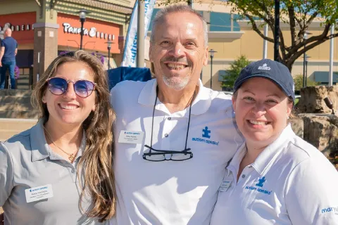 3 Autism Speaks staff at a local event