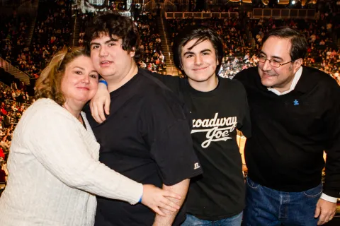 Family of four at autism-friendly event at Barclays Center.