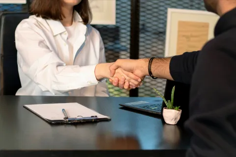Shaking hands at job interview