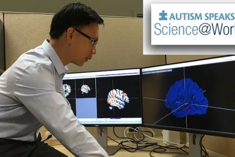 social neuroscientist Yung-Jui (Daniel) Yang looking at a computer