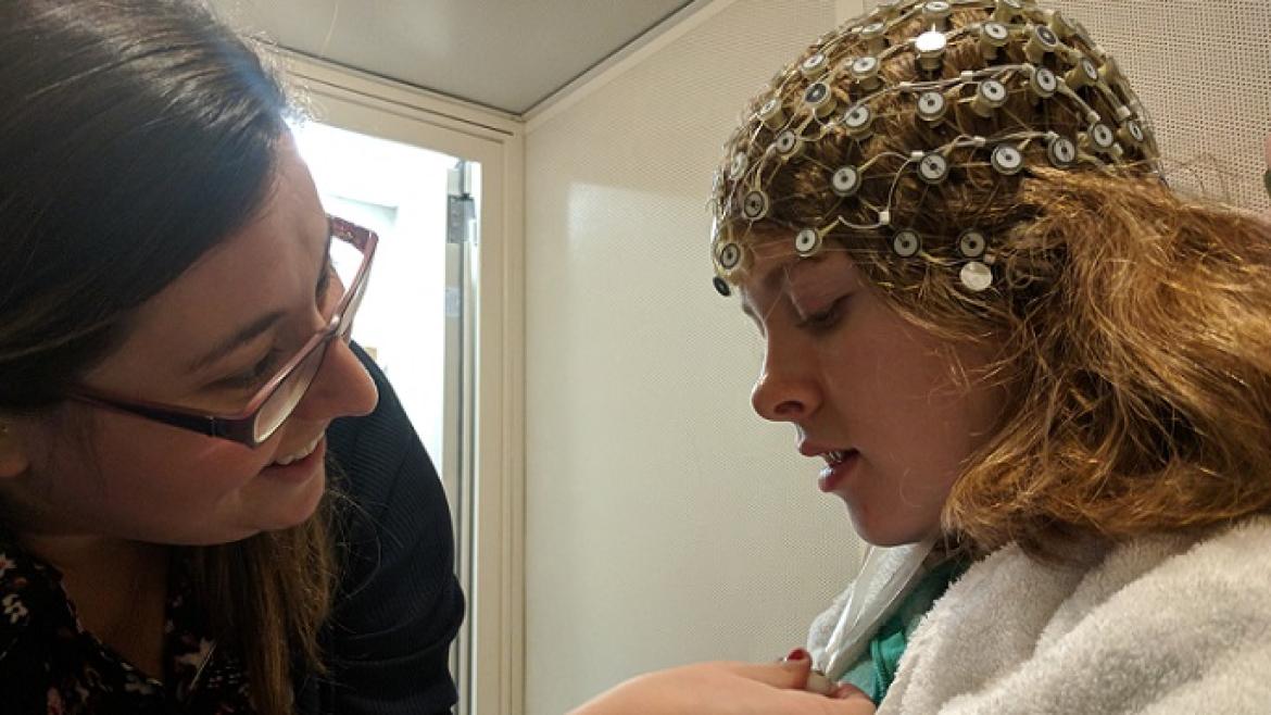 Young girl with a machine around her head during a medical exam