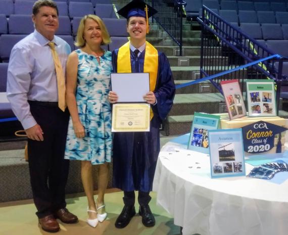 Connor at graduation with his parents