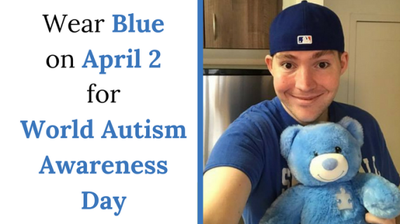 Kerry Magro wearing a blue hat, shirt and holding a blue bear to support World Autism Awareness Day