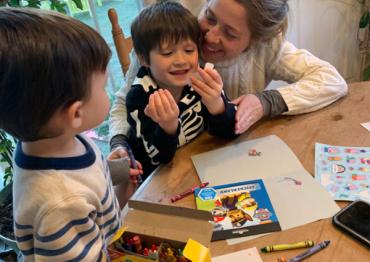 Kristen and her son Hudson coloring at the kitchen table