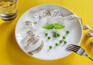 Plate with peas and measuring tape