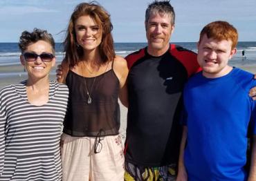 Tom and his family at the beach