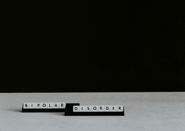 scrabble letters spelling out the words Bipolar Disorder