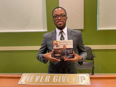 Author William A. Rose with his book