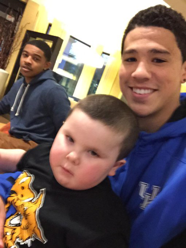 Devin Booker smiling for a selfie with Shaun
