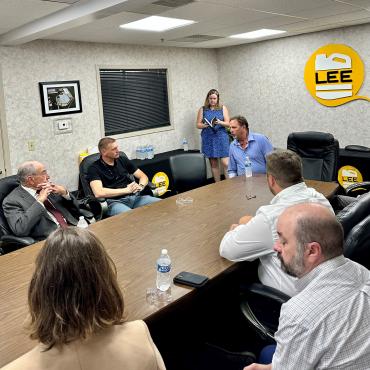 Senator Grassley speaks with Lee Container and Autism Speaks staff