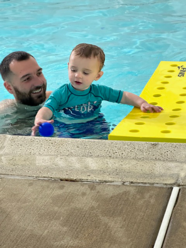 Jack and his dad in a pool