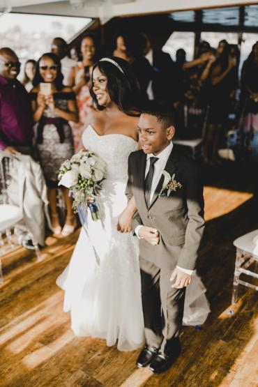 Jeremiah and his mom, Michelle, walking down the aisle at her wedding