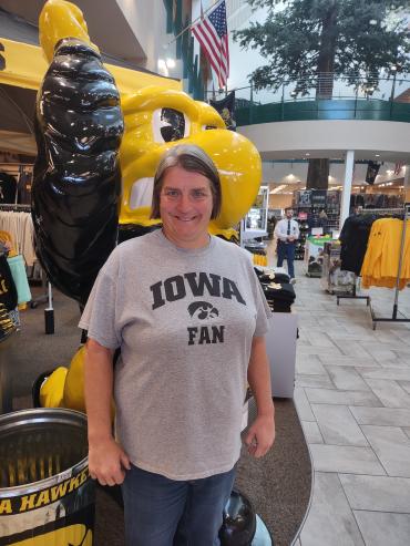 Joanna standing in front of the Hawkeyes mascot