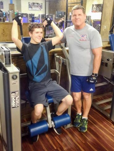 Connor and his dad in the gym