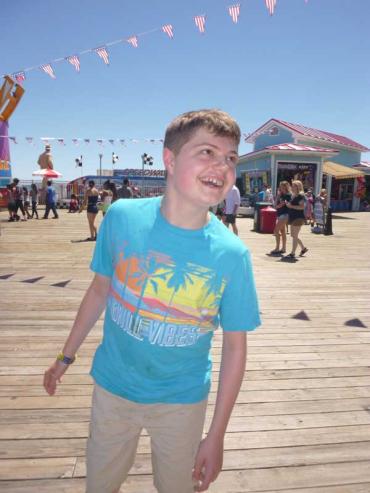 Kimberlee Rutan McCafferty's son Justin on the boardwalk