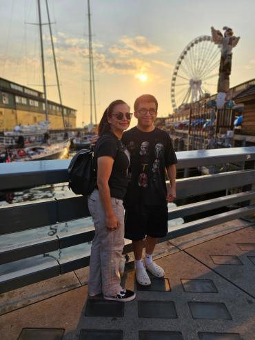 Kimberly Mariajimenez and her son Blake standing in front of a ferris wheel