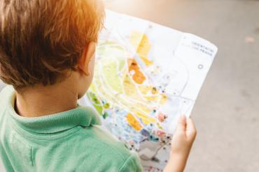 child looking at map