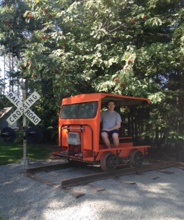 Patrick Vaillancourt sitting in an orange train